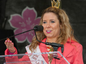 Rainey Sewell, this year’s national cherry blossom queen, addresses the audience during the stamp dedication ceremony