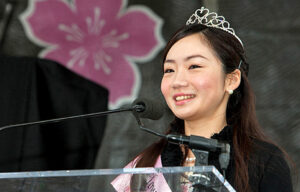 Eriko Minami, the Japan flowering dogwood queen, speaks at the ceremony.