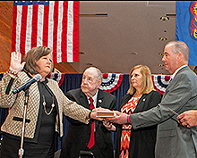 Megan Brennan takes the oath as the 74th Postmaster General.