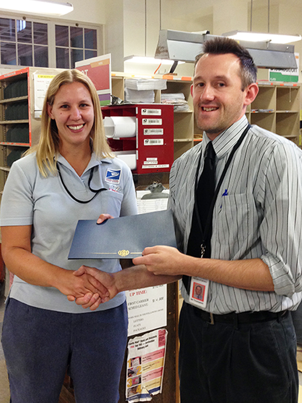 Wellsville, NY, Letter Carrier Kelly Chapman and Customer Services Supervisor Ian Thompson
