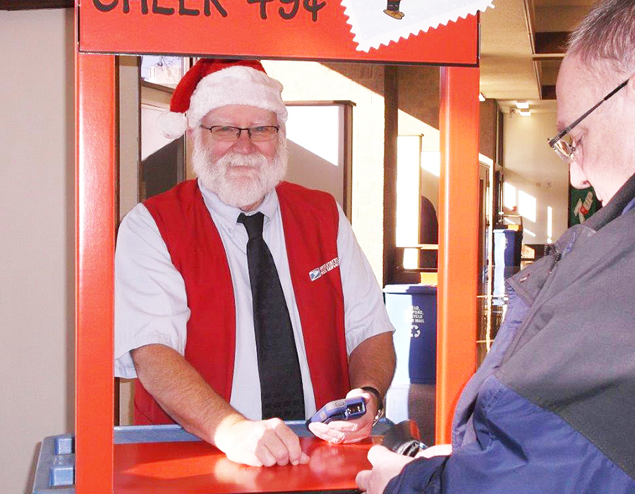 La Crosse, WI, Retail Associate Larry Potter serves a customer in December.