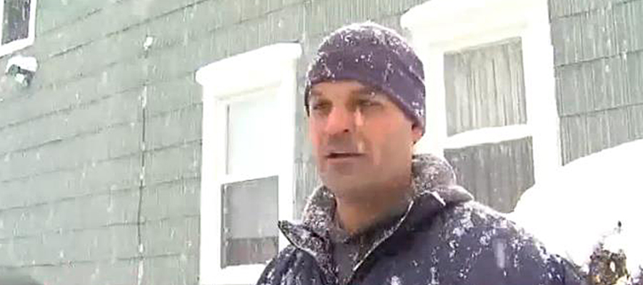 A TV news report shows Syracuse, NY, Letter Carrier Matthew Bregande braving snowy weather.
