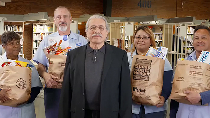 Actor Edward Olmos and several USPS employees.