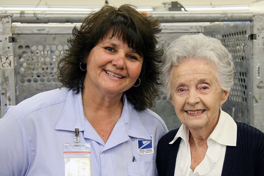 Lakewood, CA, Letter Carrier Marcela MacLean and Marilyn Erickson, the customer’s wife.