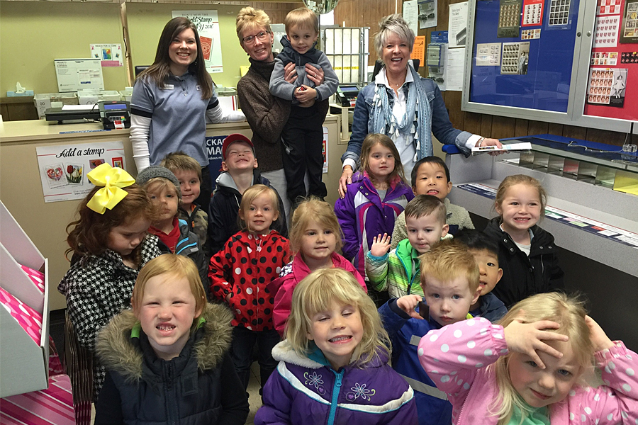 Allegany, NY, Retail Associate Sierra Ellis, left, and Postmaster Valerie Tigh, center, gather with teacher Debbie Beatty and students from Sonshine Christian Preschool last week.