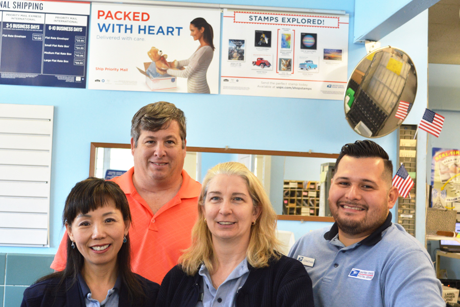 The Tobyhanna, PA, Post Office regularly ranks highly in retail performance. Postmaster Robert Grasso stands behind, from left, retail associates Sonha Mayatte, Patricia Lombardi and Jonathan Figueroa.