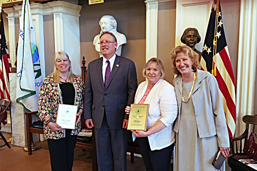 Present at the recent awards ceremony were Julie Theroux; Curt Spalding, an EPA administrator; Hinsdale, NH, Postmaster Cindy Mason; and Anne Fenn, an EPA program manager.