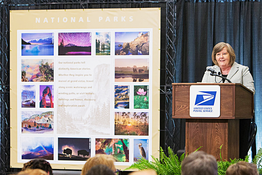 PMG Megan J. Brennan speaks at the National Parks stamp dedication June 2.