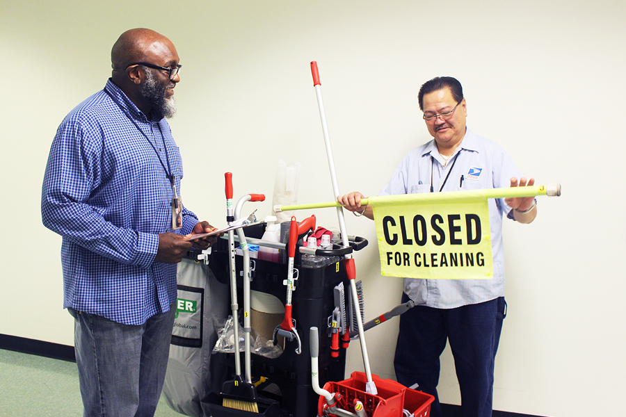 Carol Stream, IL, Maintenance Operations Supervisor Freeland Gogins and Custodian JoJo Francisco inspect tools created for the new Custodial Team Cleaning program.