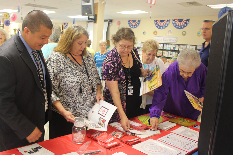 From left, Chicago Division Postal Inspector Alvin Dvorak, West Chicago, IL, Postmaster Tracy Willis and St. Charles, IL, Postmaster Cynthia Schwartz provide information at a recent event.
