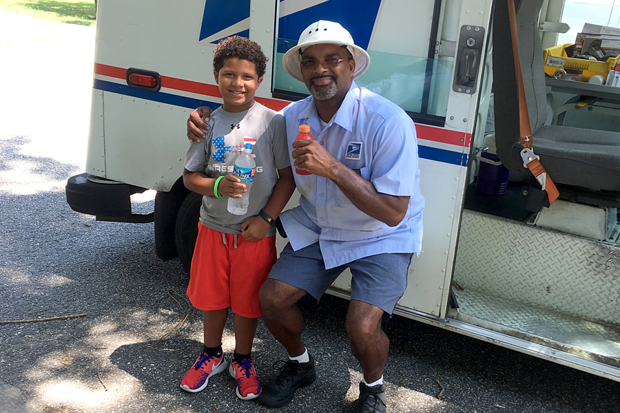 Carmine McDaniel and Newport News, VA, Letter Carrier Henry Bailey share cold beverages recently.