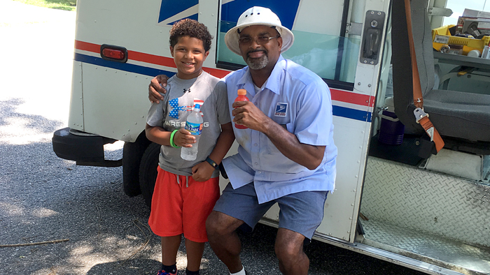Carmine McDaniel and Newport News, VA, Letter Carrier Henry Bailey share cold beverages this week.