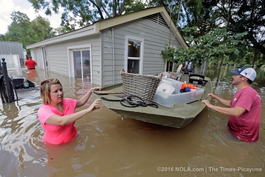 Amie Harpole, left, works to salvage some things from her home in St. Amant, LA, this week. Image: The Times-Picayune
