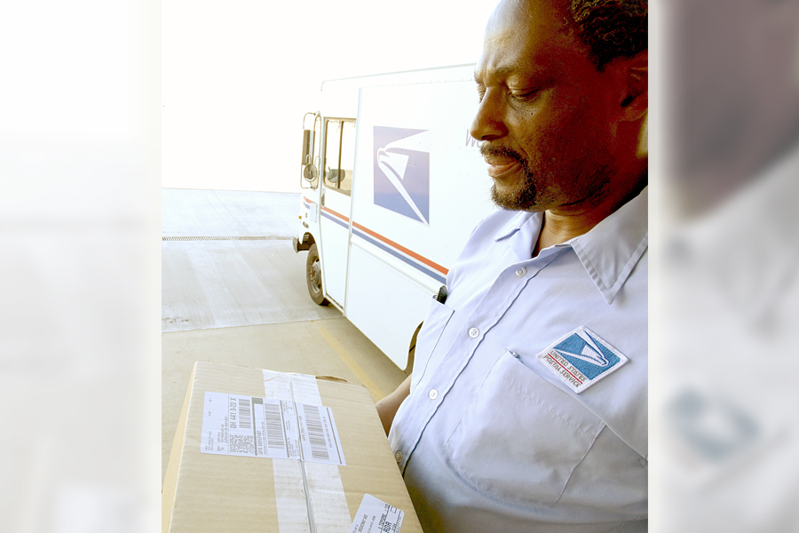 Cleveland Letter Carrier Marvin Reese holds a Parcel Select package this week.