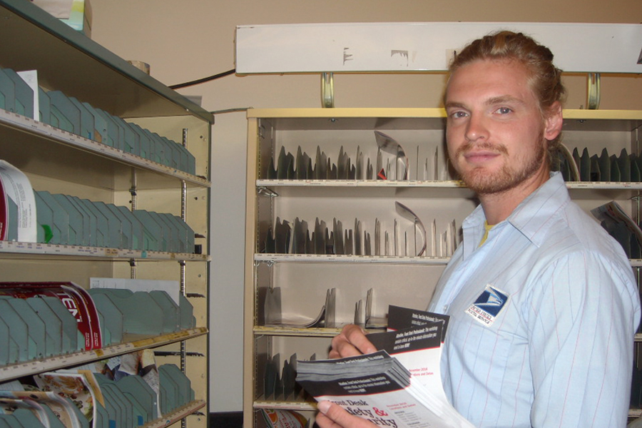 Oklahoma City Letter Carrier James Tilton cases mail this week in Oklahoma District, the top performer in third-quarter Periodicals mail performance.