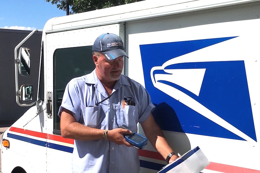 Colorado Springs, CO, Letter Carrier Todd Akers scans a package in Western Area, which led the nation in third-quarter scanning scores.