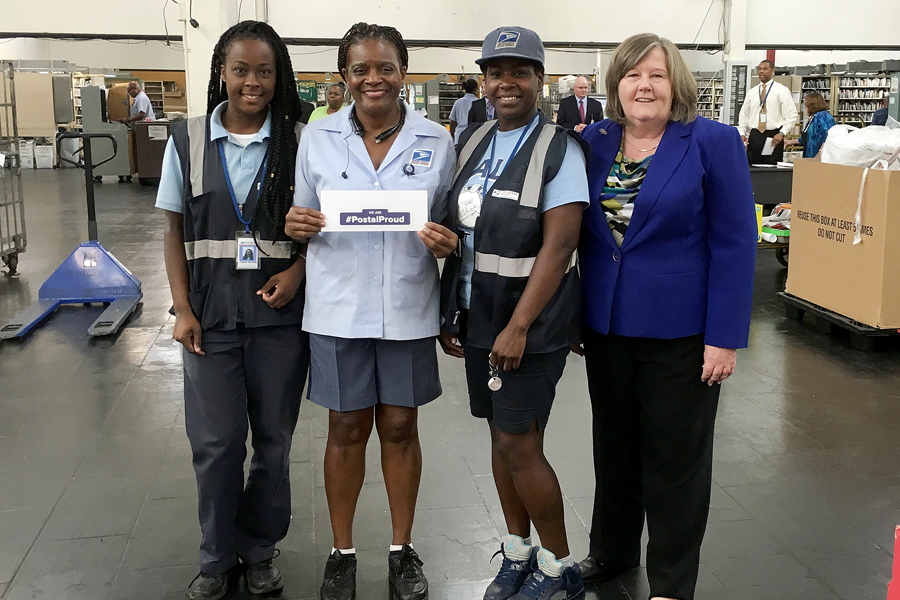 In Louisiana, City Carrier Assistant Alvinesha Matthews, Letter Carrier Bezeit Miles and City Carrier Assistant Lynika Walker share their postal pride with PMG Megan J. Brennan.