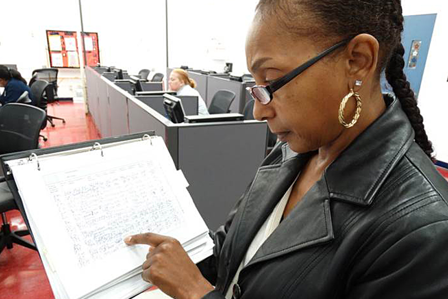 Sarita Montgomery, a Northern Ohio District Election Mail coordinator, checks an Election Mail log recently.