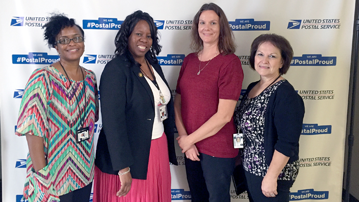 Los Angeles International Service Center Plant Manager Tracie Hill-Sandifer, second from left, recently welcomed Michelle Lucas, RaeJean Boggs and Dolly Lund.