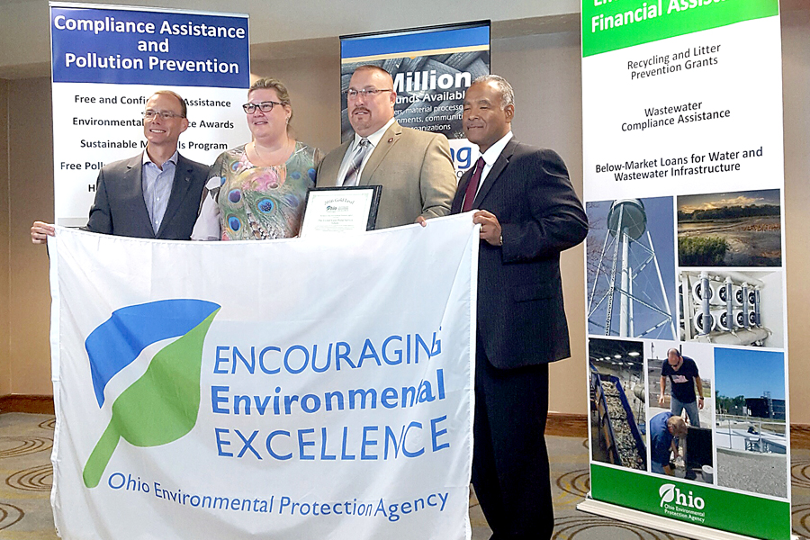 Ohio Environmental Protection Agency Director Craig Butler, left, presents the award to Walbridge, OH, Postmaster Kimberly Hazel-Myers, Northern Ohio District Recycling Coordinator Leo Brenot and Toledo Plant Manager Reginald Truss.