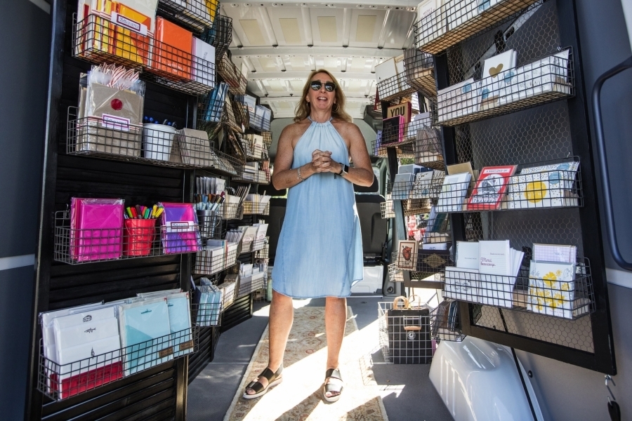 Rachel Weir, a self-described “letter farmer,” stands inside her mobile stationery store. Image: The Seattle Times