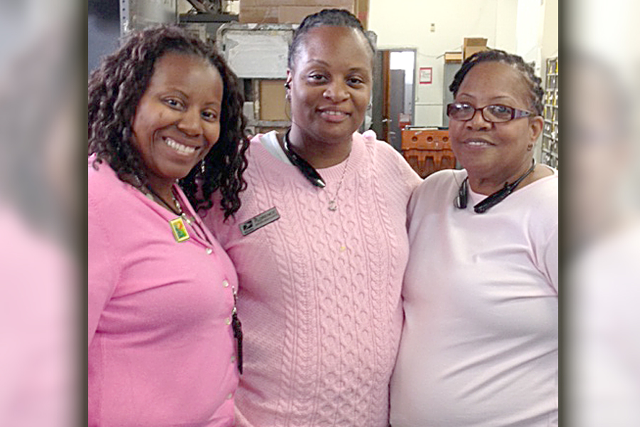 New York City retail associates Carolyn Smith, Florence Green and Gloria Spencer wear pink to show their support for breast cancer awareness last year.