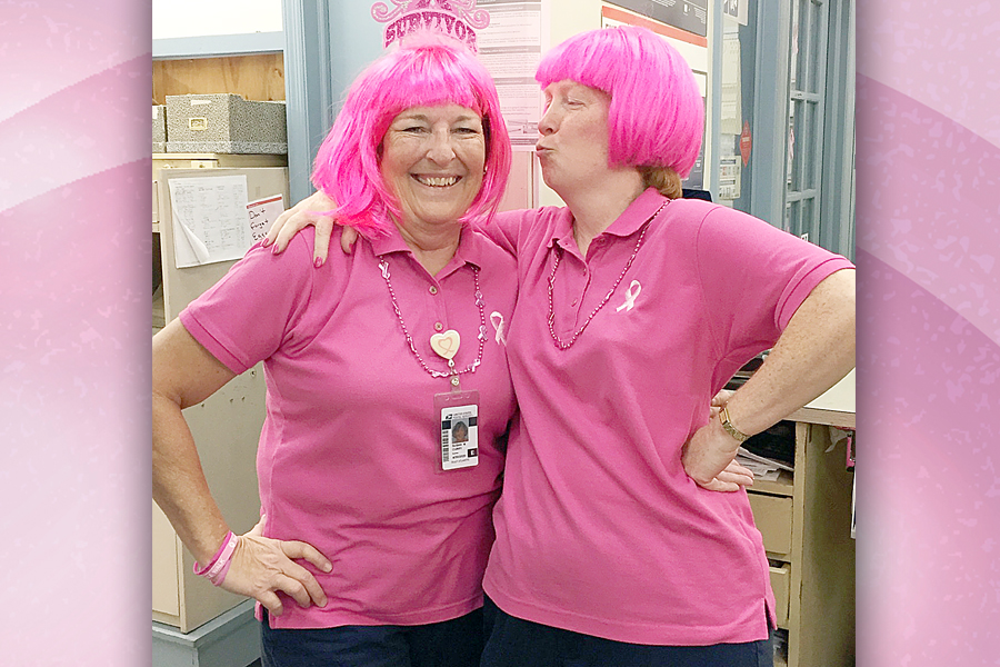 Trenton, SC, Postmaster Susan Curry, left, celebrates being a breast cancer survivor with Retail Associate Angela DeRemigio.