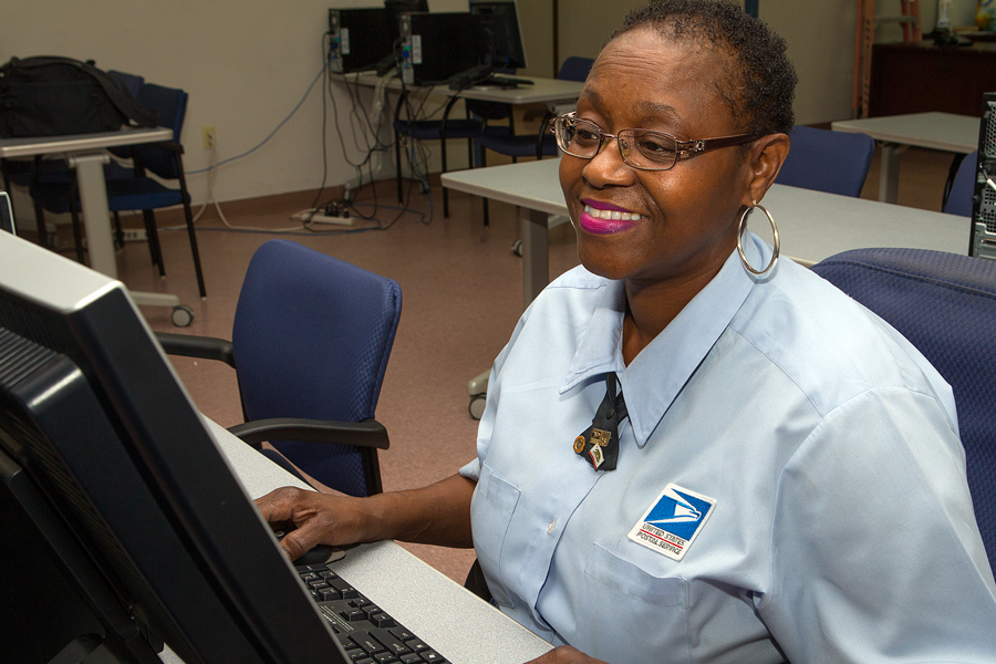 Pamela Carter, a Washington, DC, letter carrier, reviews her benefits options during this year’s open season.