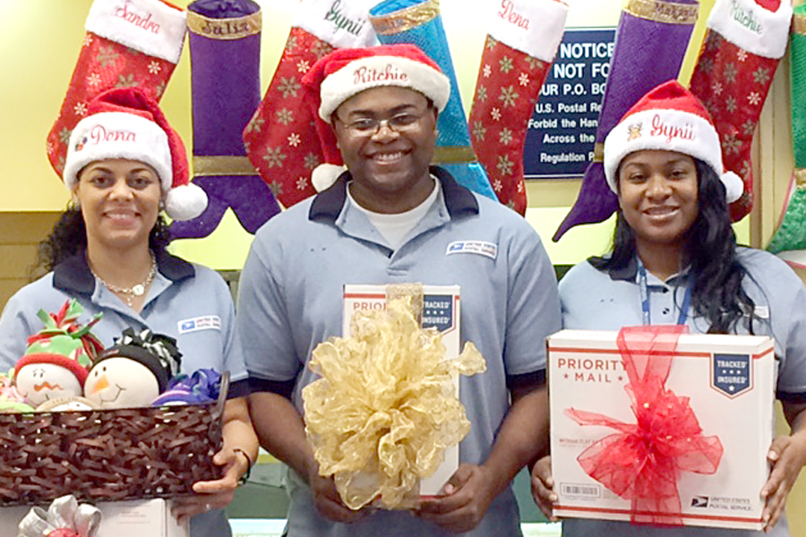 The Lacombe, LA, Post Office is ready to serve customers Dec. 19, which is expected to be the year’s busiest mailing day. From left are retail associates Adinena Bedford, Ritchie Clemmons Jr. and Gynii Jackson.