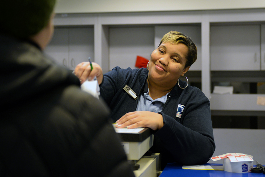 Bethesda, MD, Retail Associate Cherone Wilbon serves a customer amid the anticipation of Dec. 19, which was expected to be the year’s busiest mailing and shipping day.