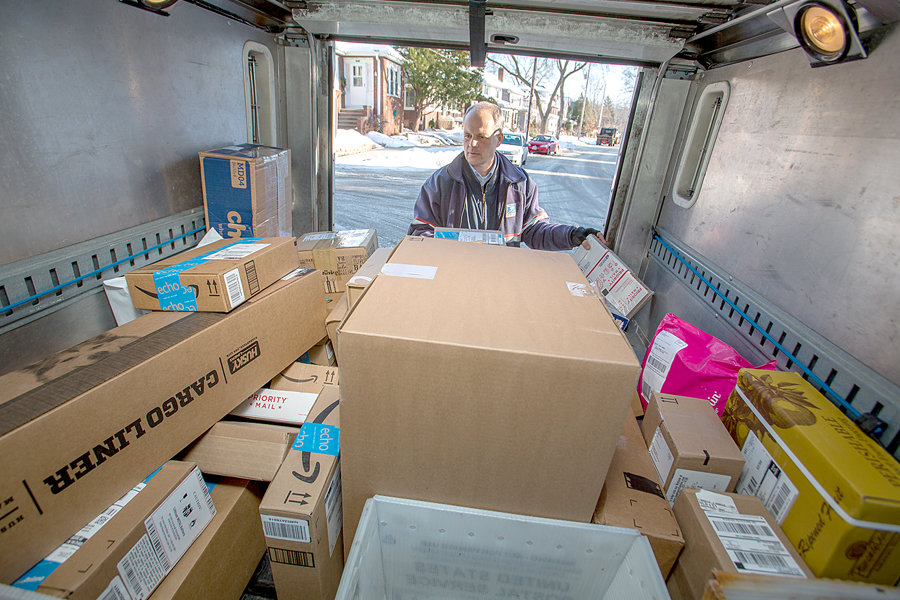 Madison, WI, Letter Carrier Brian Anderson prepares to deliver packages, which will remain an area of focus for USPS in 2017.