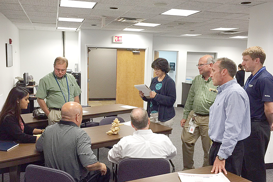 Master Black Belt Brad Golish, far right, and other Eastern Area employees participate in a recent LSS yellow belt training exercise.