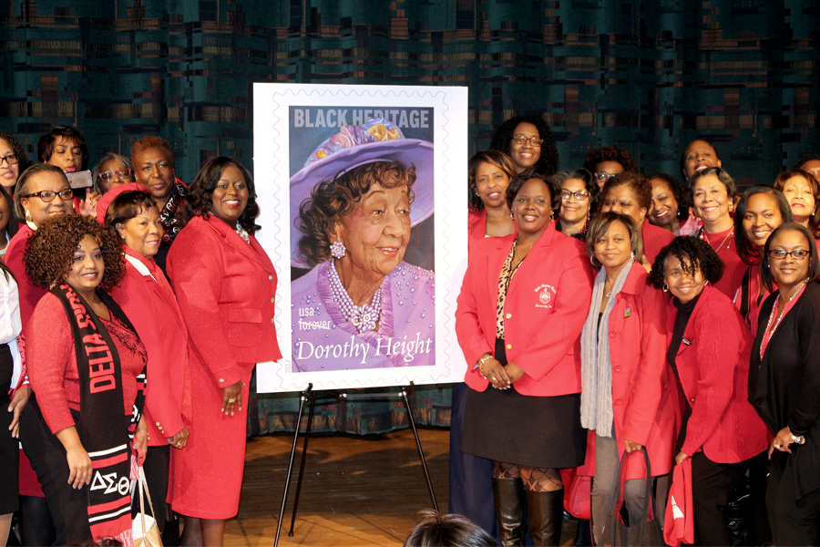 Delta Sigma Theta sorority members pose with Dorothy Height stamp