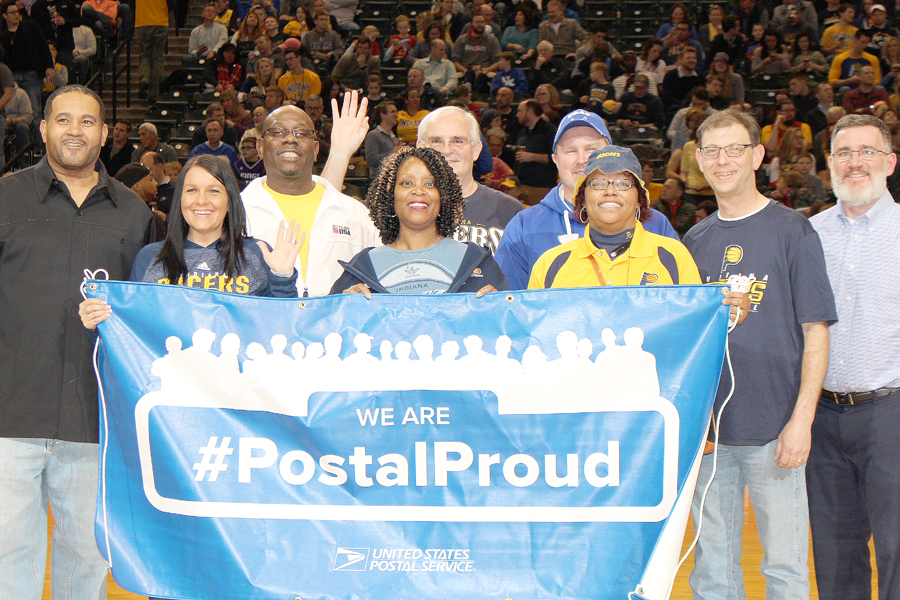 Greater Indiana District employees hold blue #PostalProud banner