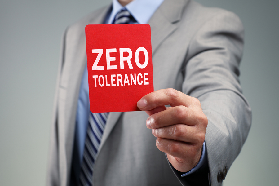 Zero tolerance sign in hand