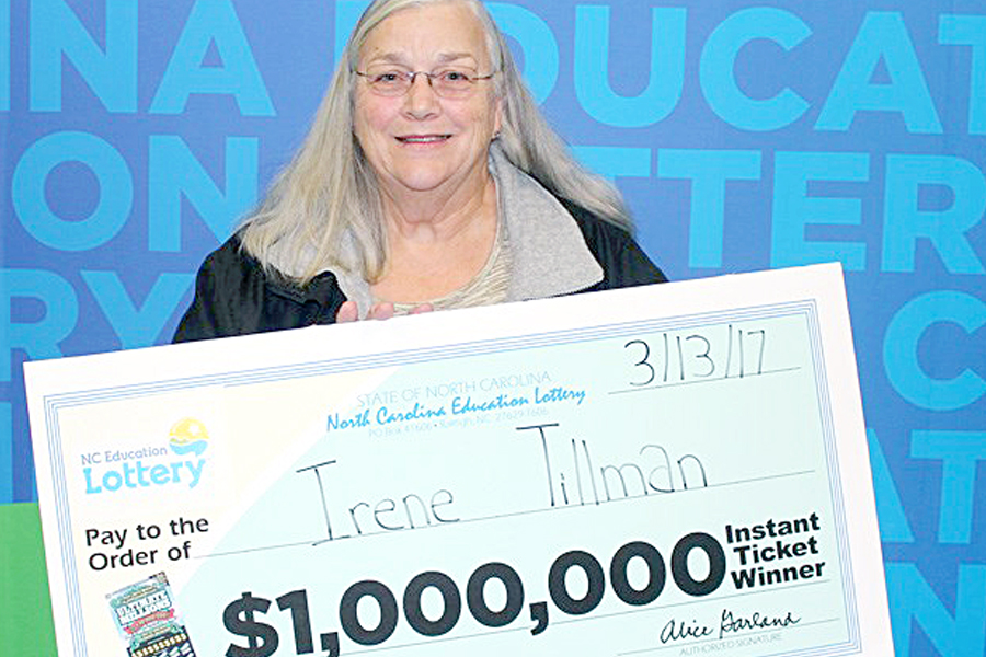 Female employee holds winning lottery check