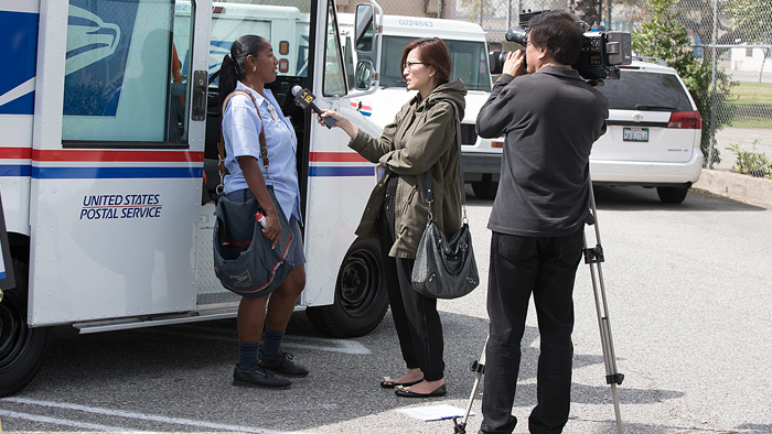 USPS employee speaks with reporters