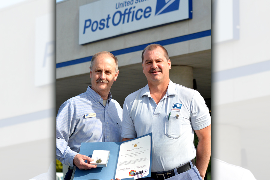 Retail Associate William Perkins, left, and Letter Carrier Wayne Able