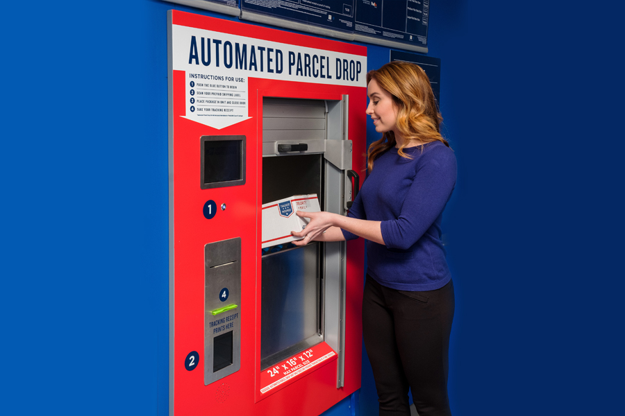 Woman drops parcel into automated parcel drop machine