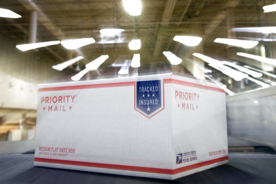Priority Mail package on conveyor belt
