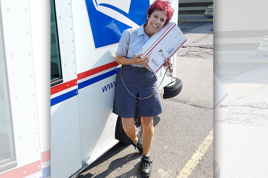 USPS employee holding package