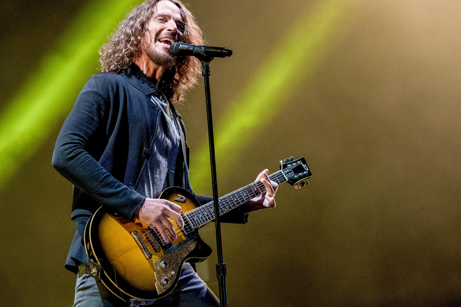Chris Cornell plays guitar on stage