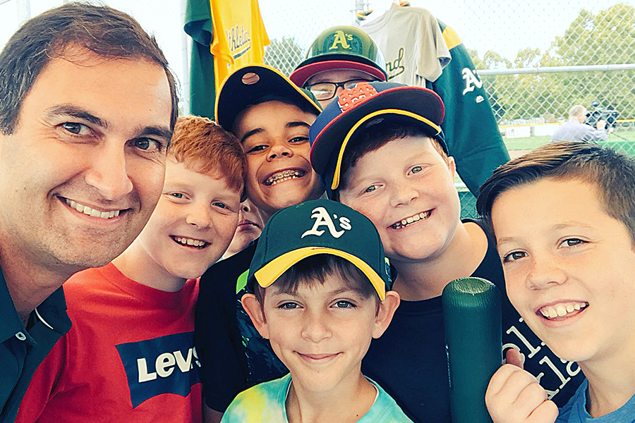 Oakland Athletics President Dave Kaval and young baseball fans