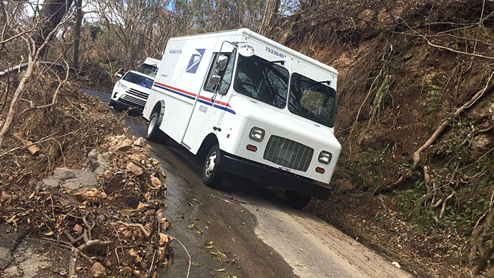 Postal trucks in mud