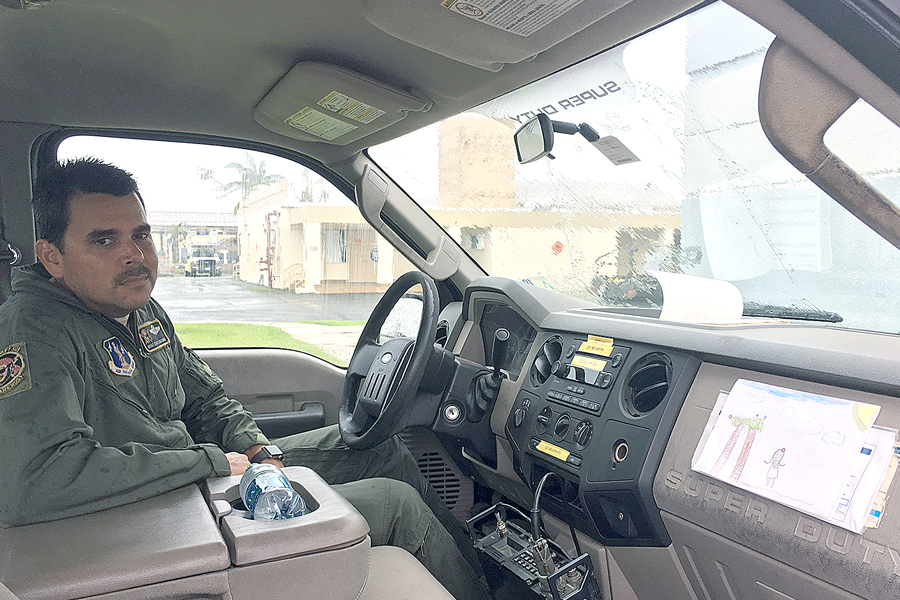 Master Sgt. Eric Circuns sits in a truck with a picture drawn by Iris.