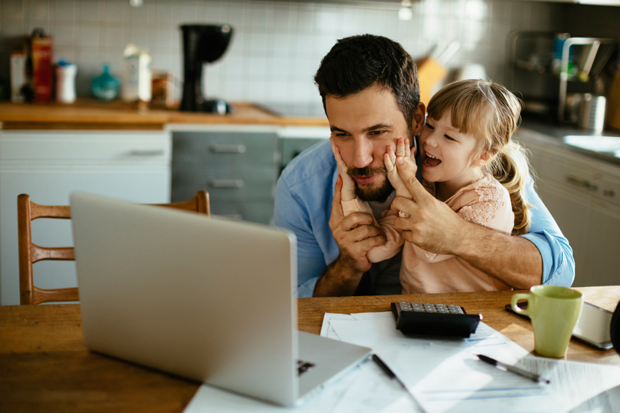 Child and dad with laptop