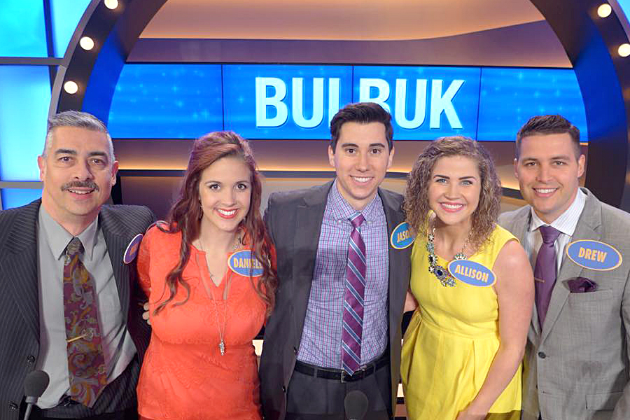 Five people on "Family Feud" set