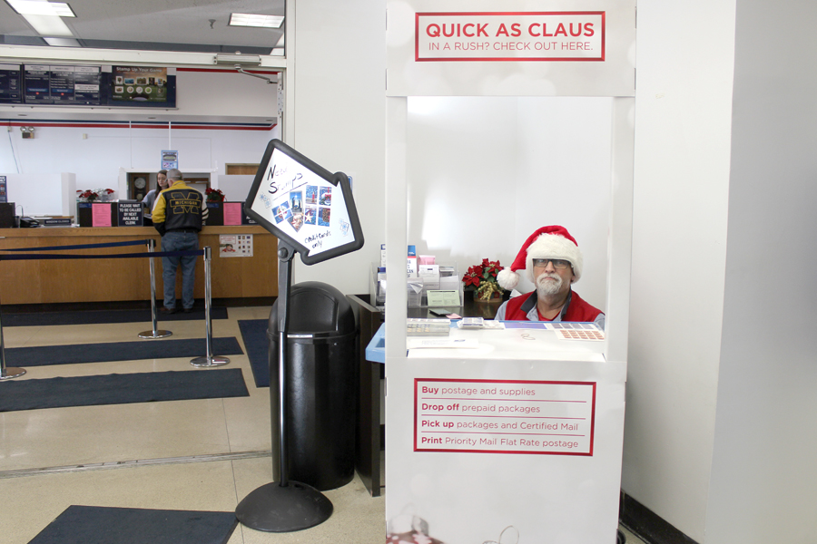 Employee seated at mobile holiday station