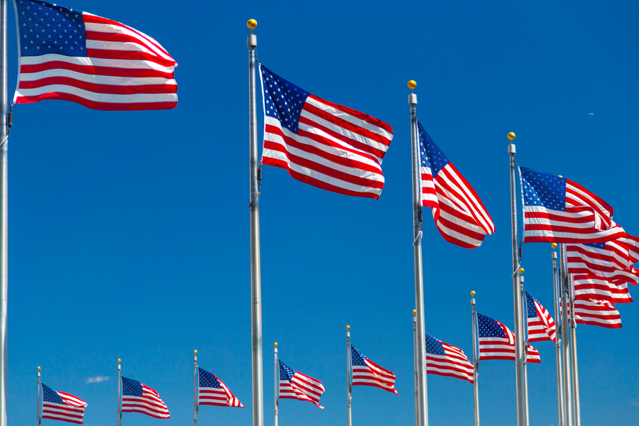 U.S. flags surround the Washington Mounument