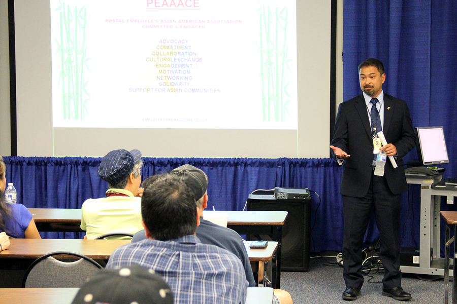 Asian-American business executive speaks to audience